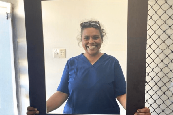 Allira posing for a photo inside the IntoJobs photo frame